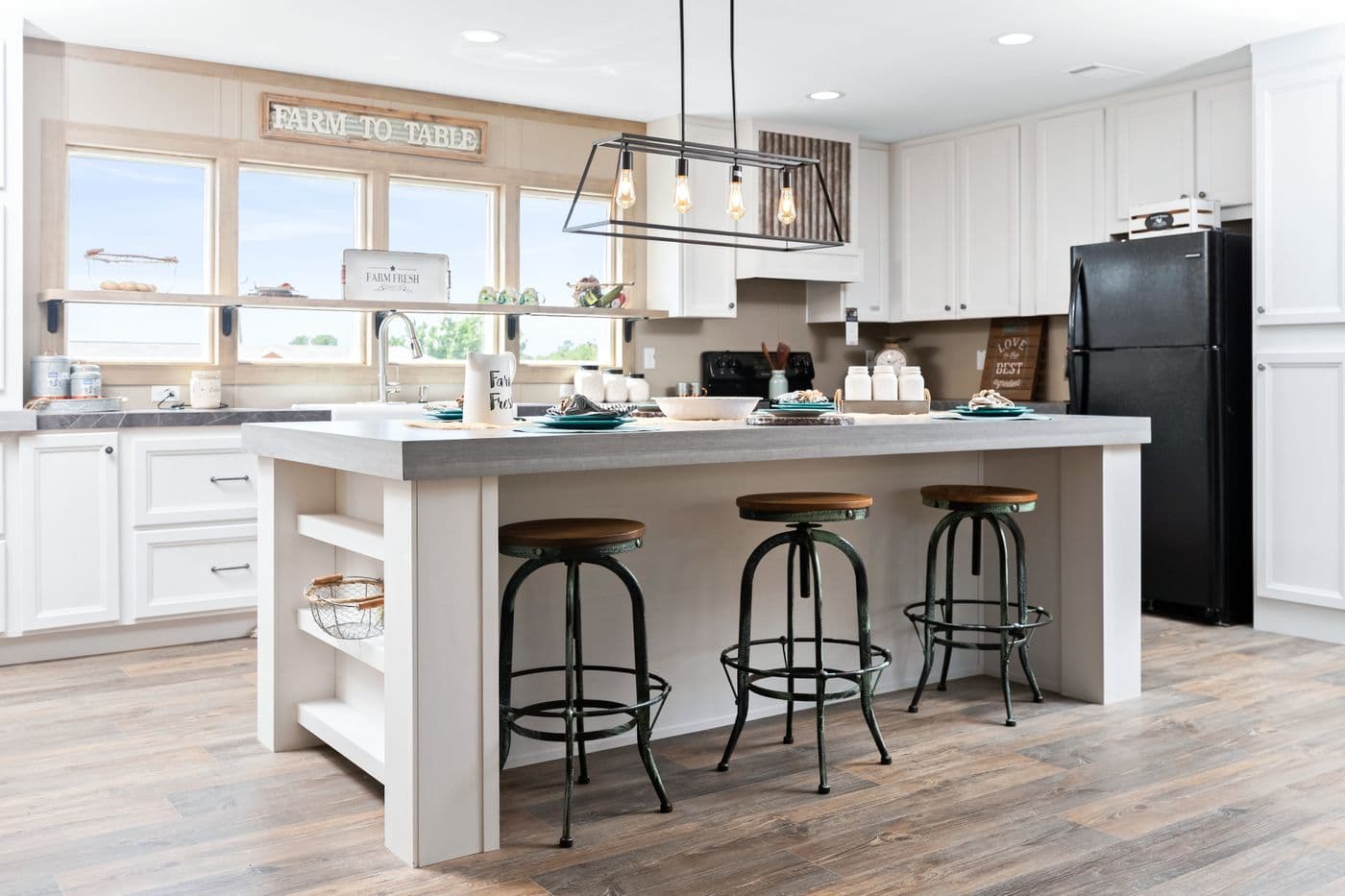 Open-plan kitchen with a breakfast-bar island inside a Family Home Choice home